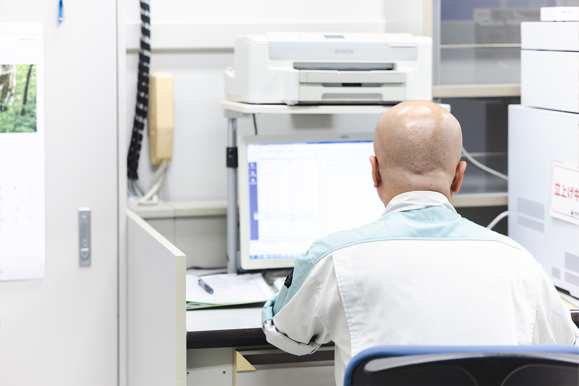 Image of a man working on a PC